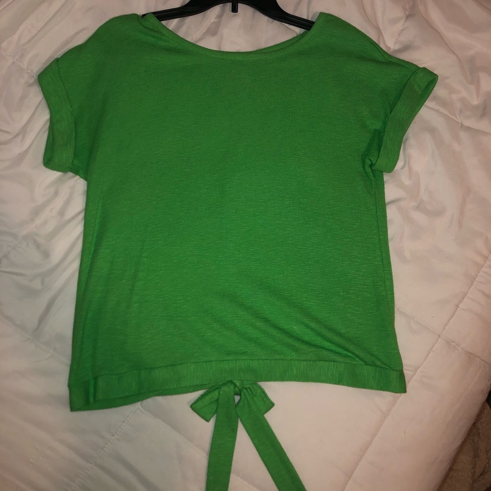 Green open back blouse.